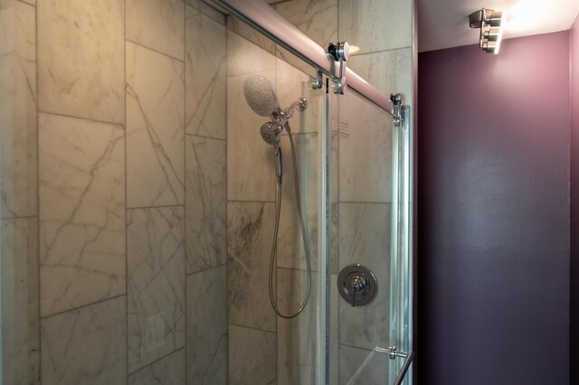 room details featuring a shower with shower door