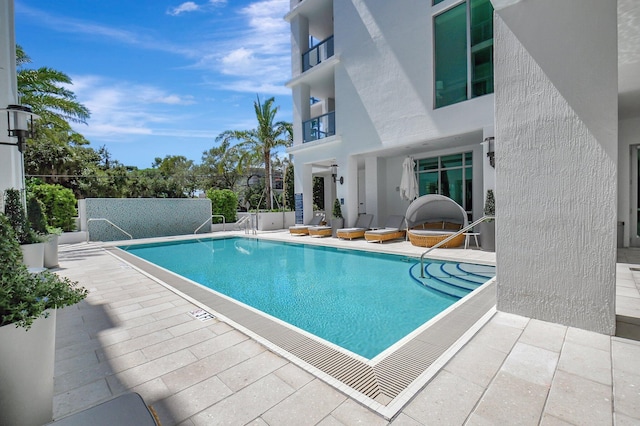 view of pool featuring a patio