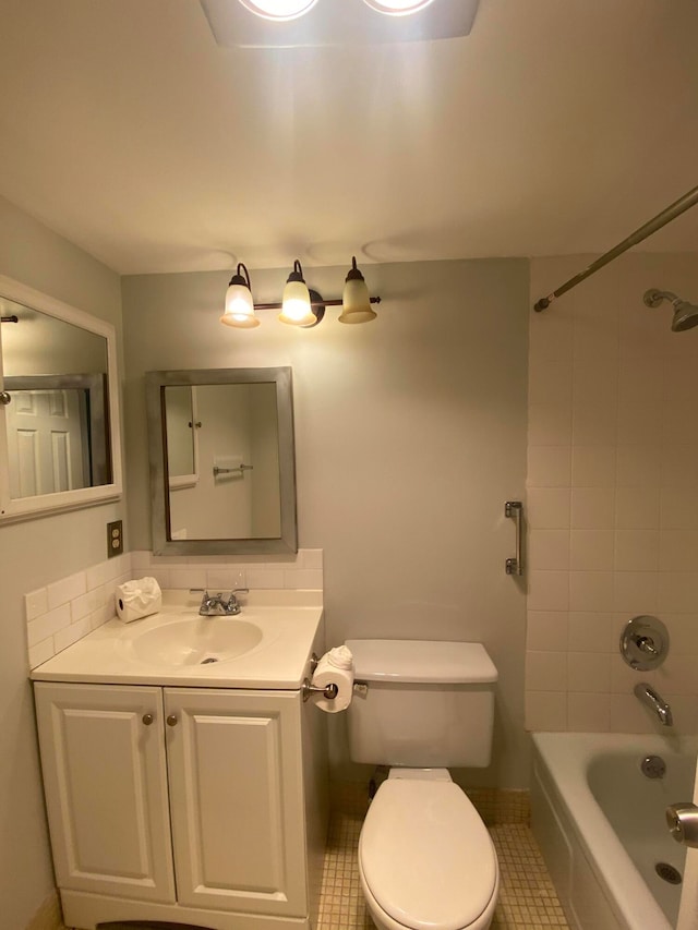 full bathroom with vanity, toilet, tile patterned floors, and tiled shower / bath