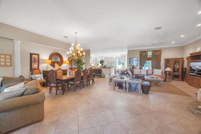 living room featuring ornamental molding, ornate columns, ceiling fan with notable chandelier, and light tile patterned floors