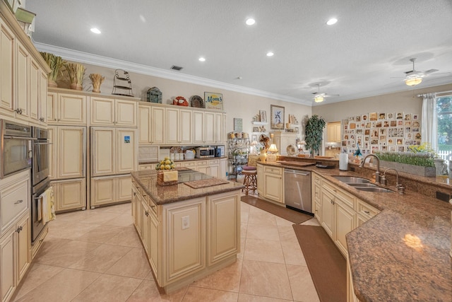 kitchen featuring cream cabinets and stainless steel dishwasher