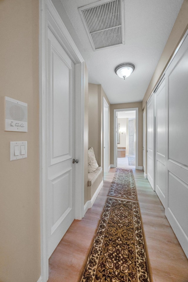 hallway featuring light hardwood / wood-style floors