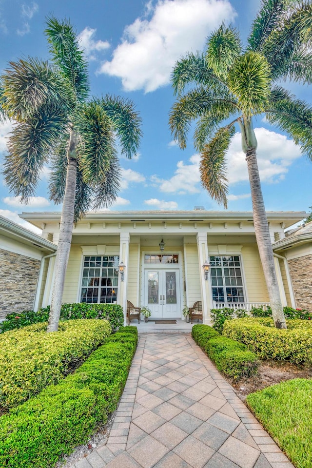 doorway to property with a porch