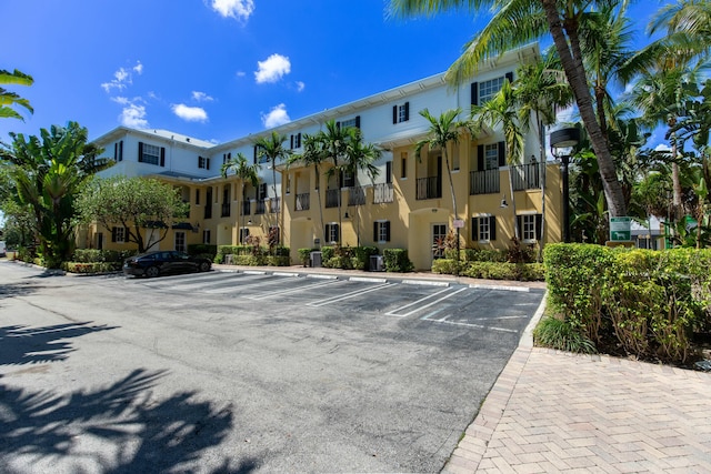 view of property featuring uncovered parking