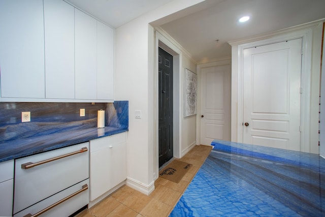 1970 S Dixie Hwy Unit R5, West Palm Beach, FL 33401 - kitchen featuring white dishwasher, dark countertops, baseboards, and white cabinetry