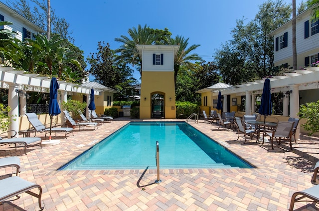 view of pool featuring a patio and a pergola