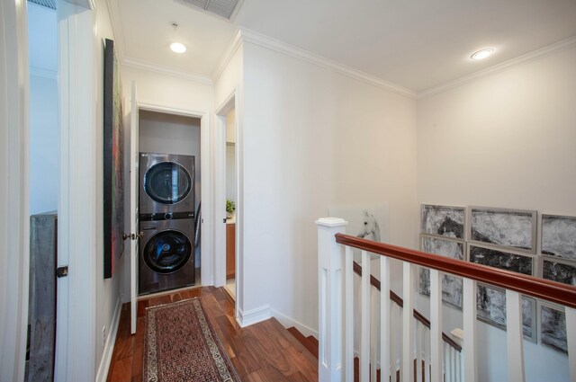 1970 S Dixie Hwy Unit R5, West Palm Beach, FL 33401 - corridor with dark wood-style flooring, visible vents, crown molding, an upstairs landing, and stacked washer and clothes dryer