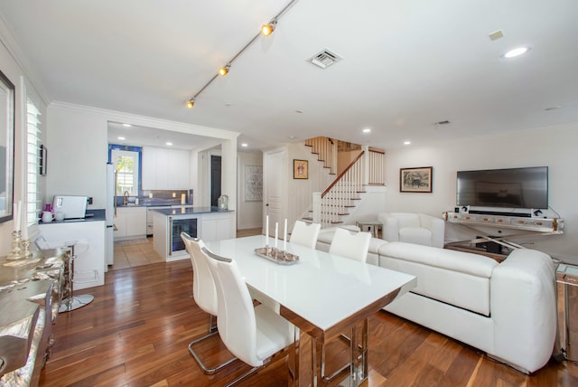 1970 S Dixie Hwy Unit R5, West Palm Beach, FL 33401 - dining room featuring visible vents, stairs, crown molding, and wood finished floors