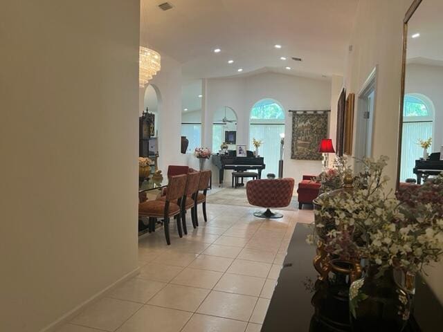 tiled living room featuring lofted ceiling