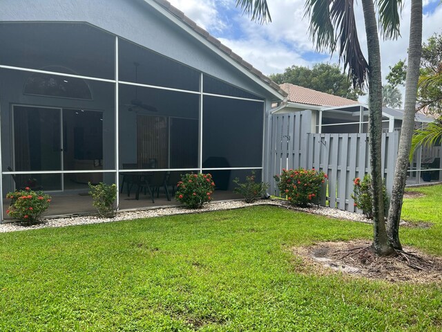 view of yard with a sunroom