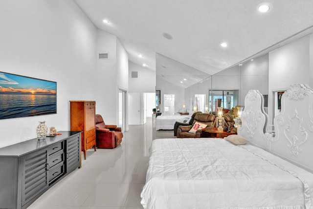 tiled bedroom featuring high vaulted ceiling