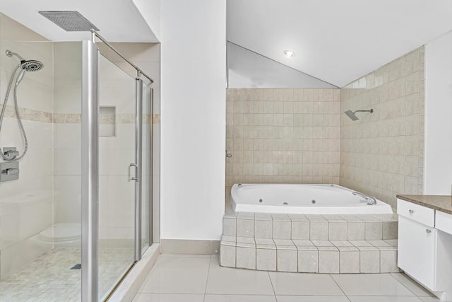 bathroom featuring shower with separate bathtub, tile patterned flooring, and vanity