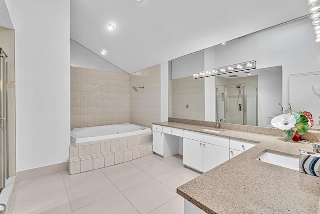 bathroom featuring shower with separate bathtub, lofted ceiling, vanity, and tile patterned floors