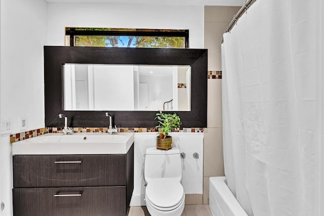 full bathroom featuring shower / bath combination with curtain, vanity, toilet, and a wealth of natural light