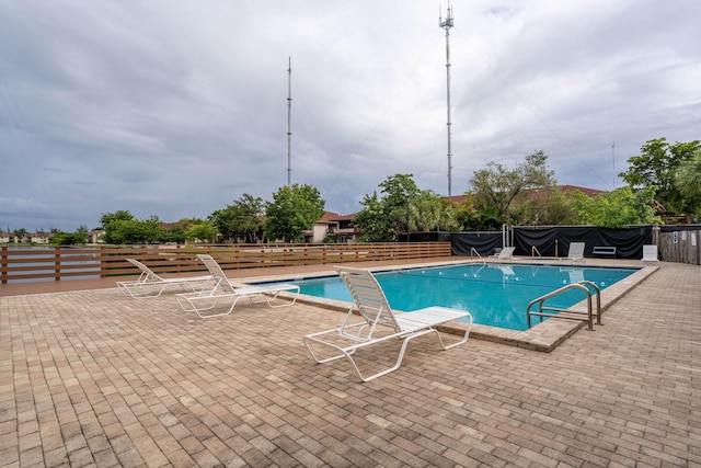 view of pool featuring a patio