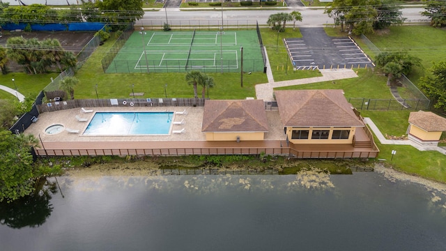 birds eye view of property with a water view