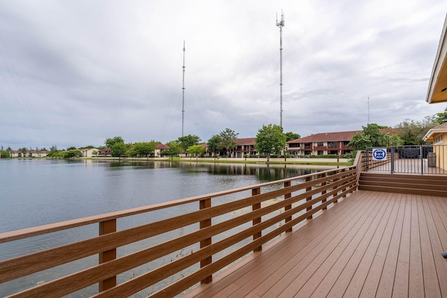 wooden deck featuring a water view