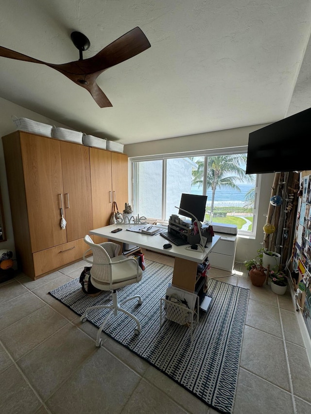 interior space featuring ceiling fan