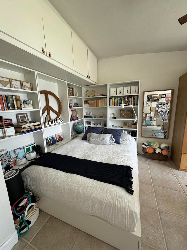 bedroom with light tile patterned flooring