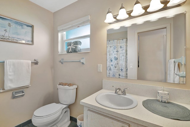 bathroom featuring vanity and toilet