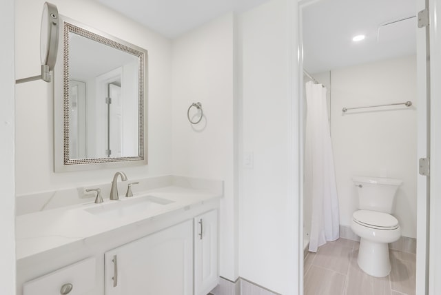 full bathroom featuring toilet and vanity