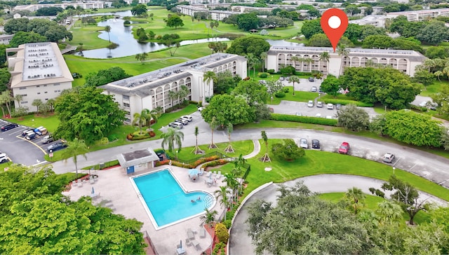 birds eye view of property with a water view