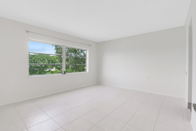 unfurnished room with light tile patterned floors