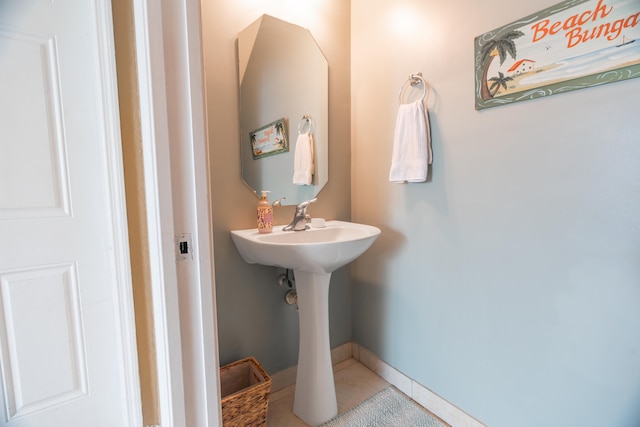 bathroom with tile patterned floors