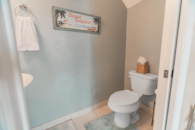 bathroom featuring toilet and tile patterned floors