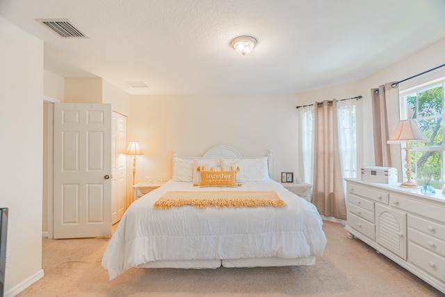 bedroom with light carpet