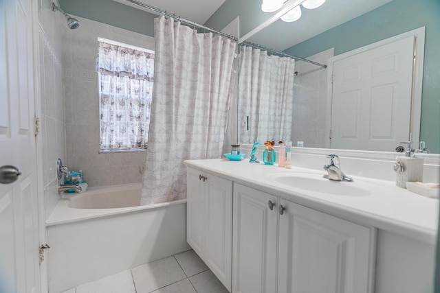 bathroom featuring vanity, shower / bath combo with shower curtain, and tile patterned floors