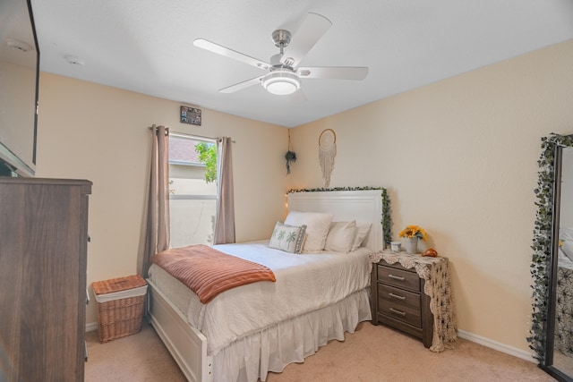 bedroom with light carpet and ceiling fan