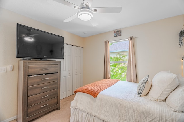 carpeted bedroom featuring a closet and ceiling fan