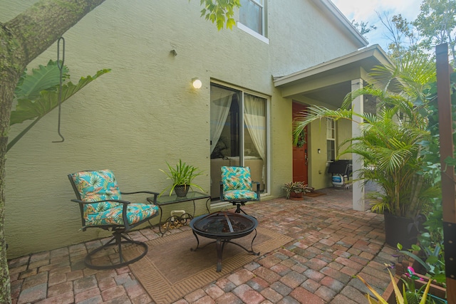 view of patio with an outdoor fire pit