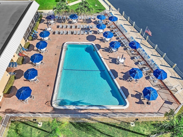 view of swimming pool with a water view