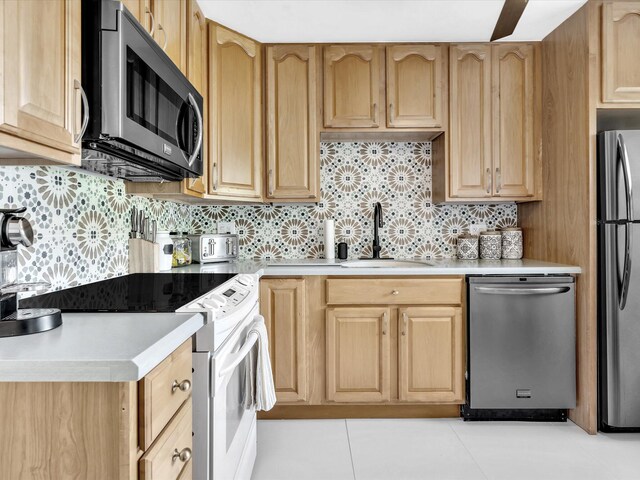 kitchen featuring kitchen peninsula, stainless steel appliances, and plenty of natural light