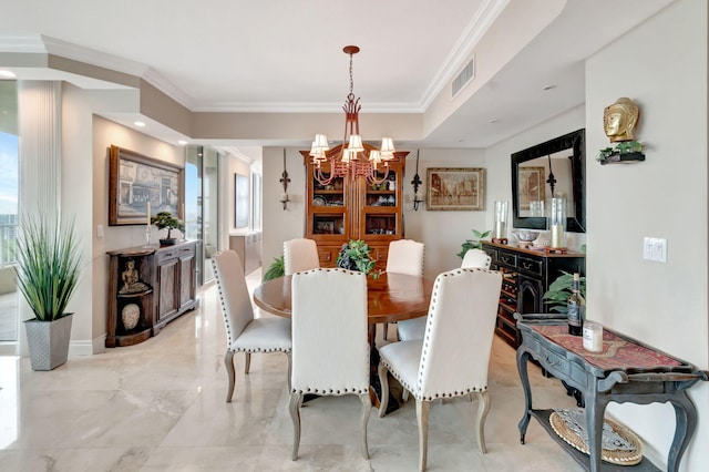 dining room with crown molding and a chandelier