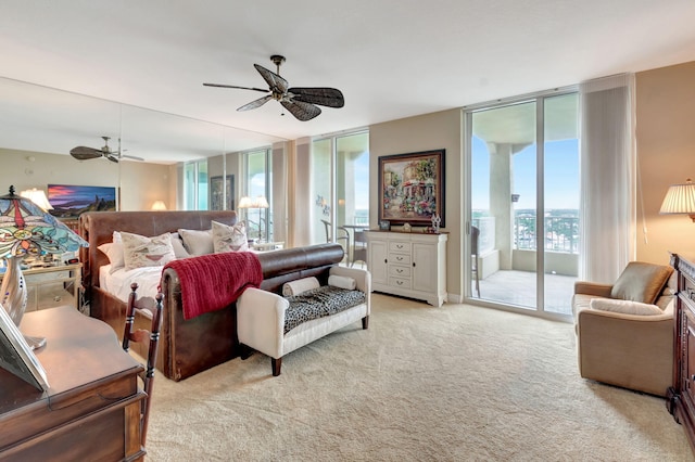 carpeted bedroom with access to outside, floor to ceiling windows, and ceiling fan