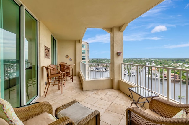 balcony featuring a water view