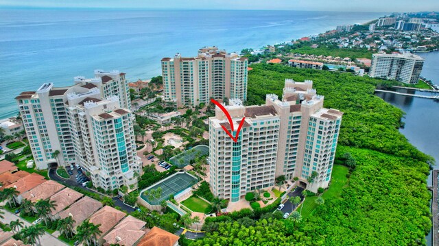 birds eye view of property with a water view