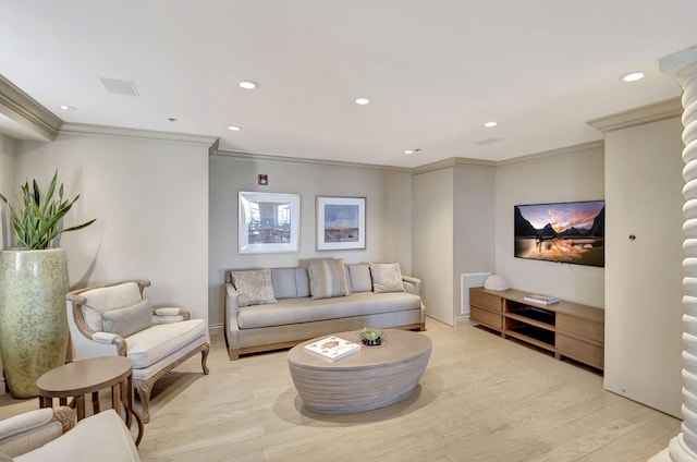 living room featuring ornamental molding and light hardwood / wood-style floors