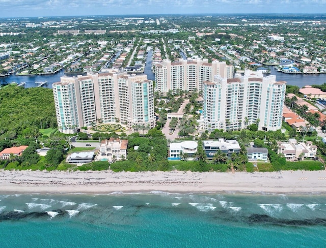 bird's eye view with a water view and a view of the beach