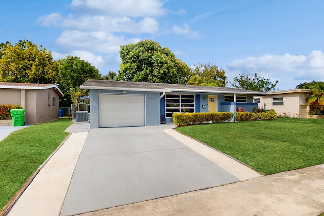 single story home with cooling unit, a garage, and a front yard