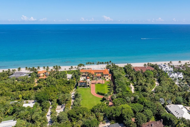 drone / aerial view featuring a beach view and a water view