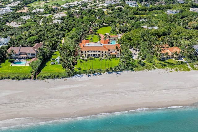 bird's eye view with a water view and a beach view