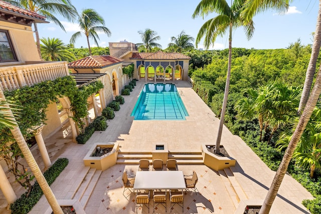 view of pool featuring a patio