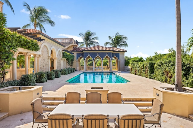 view of swimming pool with a patio area