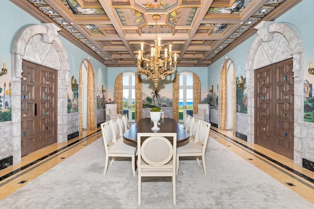 dining space featuring coffered ceiling, a chandelier, ornamental molding, and french doors