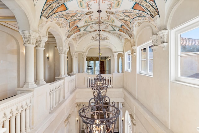 corridor featuring ornate columns