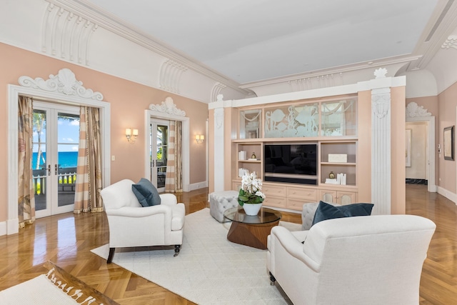 living room featuring parquet flooring, french doors, decorative columns, crown molding, and a water view